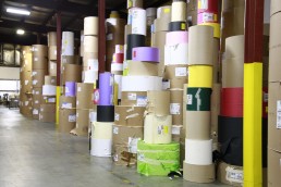 At WCI, rolls of paper stacked in the warehouse at Wisconsin Converting, Inc.