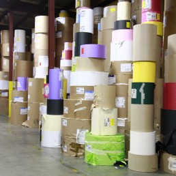 At WCI, rolls of paper stacked in the warehouse at Wisconsin Converting, Inc.