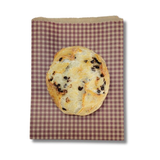 Photo of a paper bread bag with a muffin.